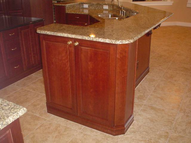 Ending your bar wall with a cabinet will add storage space and ...